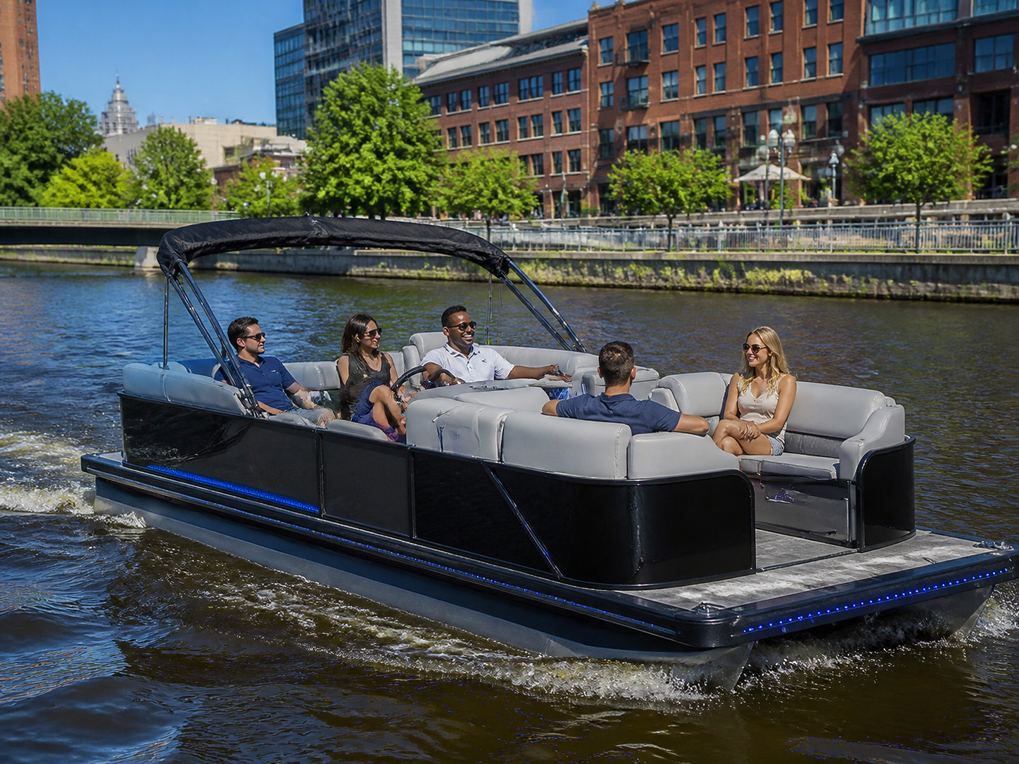 Friends enjoying a pontoon cruise on the Milwaukee River
