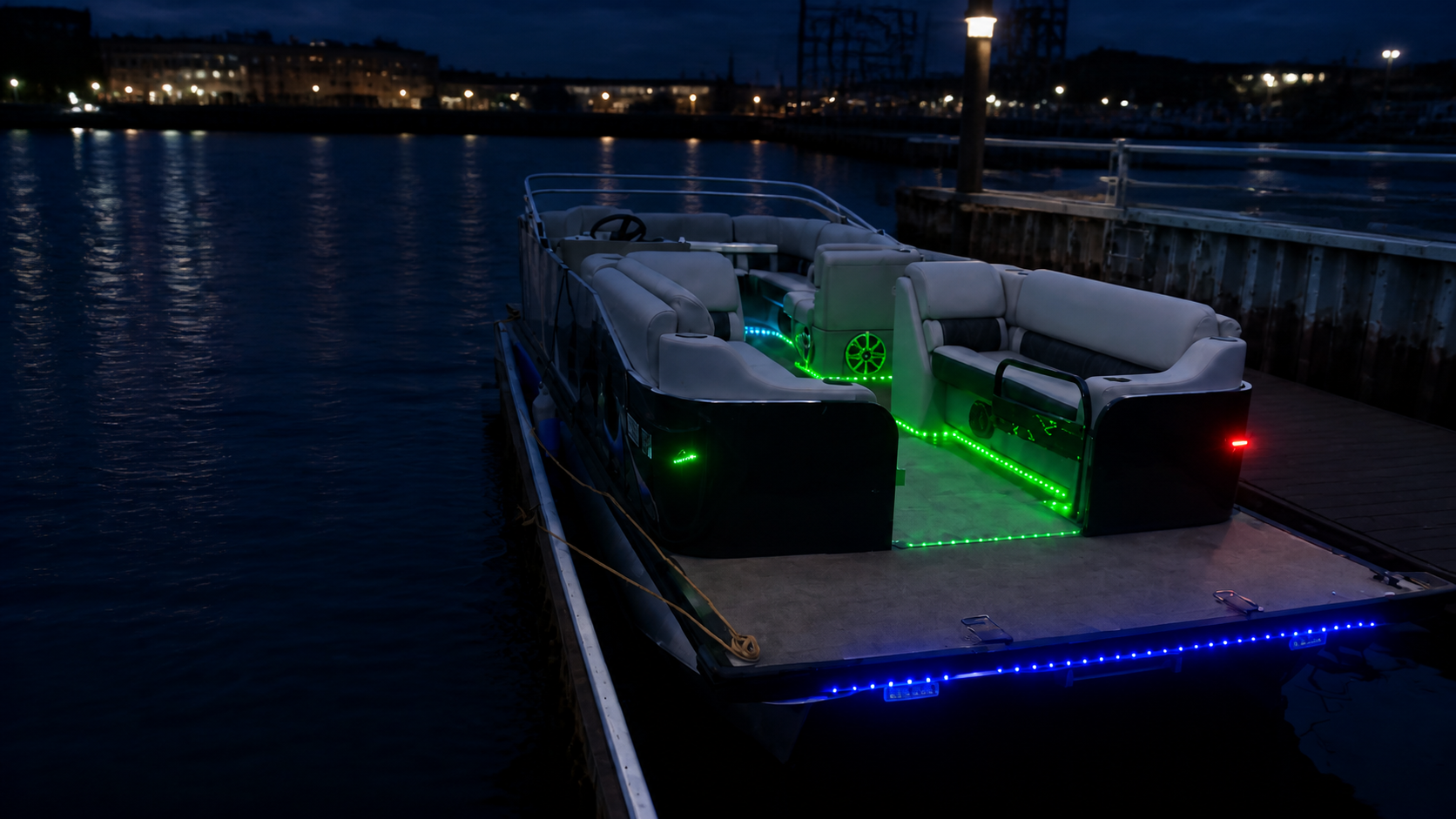 Illuminated pontoon boat docked on the Milwaukee River